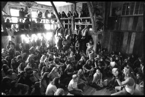 Michael Metelica addressing a crowd of commune members at a meeting inside the Brotherhood of the Spirit dormitory, Warwick, Mass. (view looking at audience over Michael's shoulder)