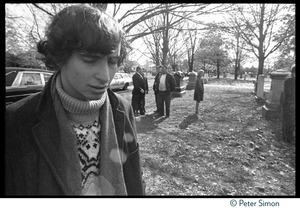 Stephen Davis (far left) at the funeral of Jack Kerouac, eyes cast downward in the cemetery