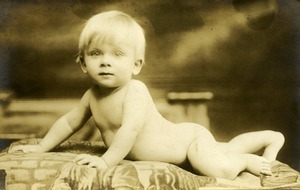 Stanley J. Lesinski: full-length studio portrait of infant sprawled on a rug