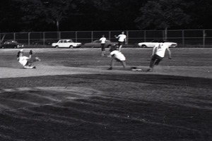 Boston Phoenix vs. WBCN staff softball game: blurry, play at second