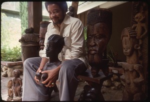 Bill Withers: Withers surrounded by African sculpture and cupping the breasts of a bust