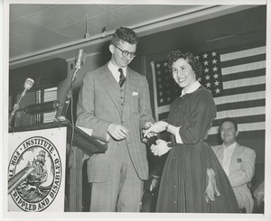 Unidentified man and woman on stage at Institute Day