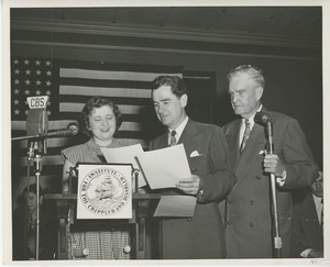 Bruce Barton, unidentified special guest and client on stage at Institute Day