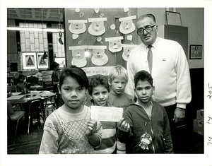 Kids at Molloy School holding check