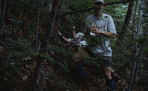 Timothy Billo (left leaning down) and Charles Wall on right, standing (both Class of 1997) in Permanent Plot 0102).