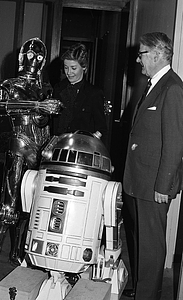 Unidentified man and woman with R2-D2 and C-3P0 from Star Wars films at Boston City Hall