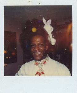 Photographs of Marsha P. Johnson Wearing a Black Tulle Headpiece with a Bunny Toy Attached