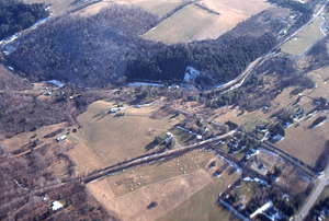 Oblique aerial photos accompanying 22 Dec 1994 Col-East air photo mission. 27. Intersection of Scott Hill Road with US Route 7 (lower right) to Stone Hill Road (middle distance) and Green River Road, Green River, and Mount Hope Farm in distance.