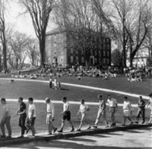 Juniors march into the Science Quad prior to the Gargoyle tapping ceremony, 1965