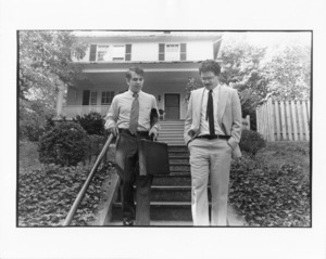 Black and white photograph of Paul Tsongas and unidentified man descending steps
