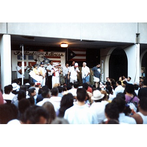 Performers on a makeshift stage at a rainy Festival Betances.