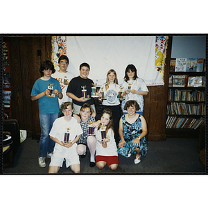 Group portrait of award winners holding their trophies at the Charlestown Best Year In School Program Awards Night