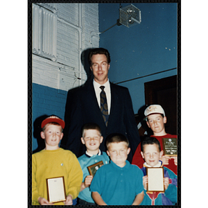 Former Boston Celtic Dave Cowens posing for a group picture with five boys at a Kiwanis Awards Night