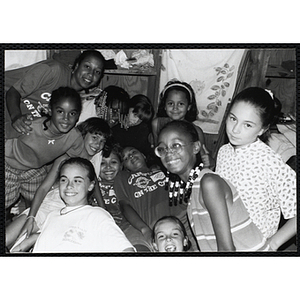 "Satellite of the BGCB," twelve girls posing together at the Chelsea Clubhouse, Boys and Girls Clubs of Boston