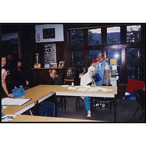 A Group of women sitting and standing during an open house