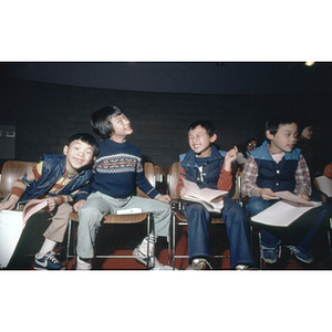 Four boys attend a Chinese Progressive Association Christmas party