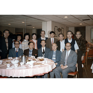 Members of the Chinese consulate in New York City sit with members of the Chinese Progressive Association at a restaurant table