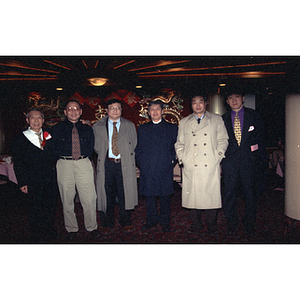 Men pose for a photograph at a restaurant for a celebration of the Chinese New Year with the Chinese Progressive Association