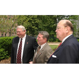 Three men stand together at the Veterans Memorial groundbreaking ceremony