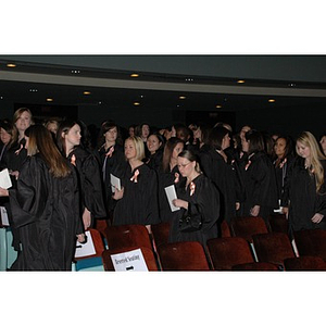 Students stand at School of Nursing convocation