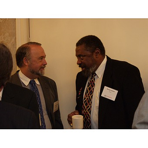 William Smith, right, talking with another guest at the College of Business Administration's CEO Breakfast Forum