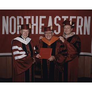 Dennis Picard is hooded at the honorary degree ceremony