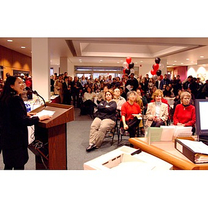 Maria Hudson Carpenter, at podium, speaking in Snell Library lobby