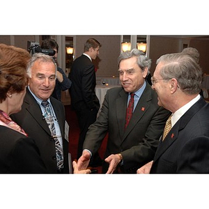 President Richard Freeland, second from the right, greets guest at Alumni Ball