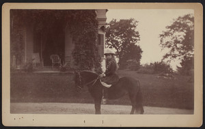 Unidentified girl riding a pony