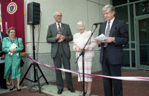 Dedication ceremonies for the Conte Polymer Center: Chancellor David K. Scott addressing the crowd, with Corinne Conte and John Olver