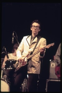 Elvis Costello and the Attractions in concert: Costello on guitar