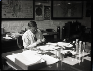 T. J. S. Boake at his desk