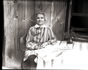 Dorothy Canfield Fisher seated at a table