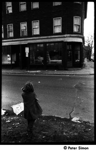 Young girl walking up Harvard Street near intersection with Columbia, Cambridge, Mass.
