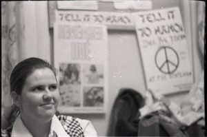 Young Americans for Freedom (YAF) office: YAF member seated in front of posters for "Tell it to Hanoi" rally