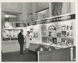 Man and woman in front of ICD exhibit