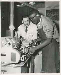 Two men in machine shop