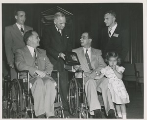 President Harry S. Truman handing a plaque to Nils S. Josefson