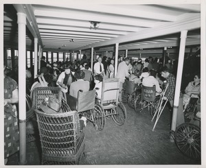 Wheelchair users in boat during boat ride