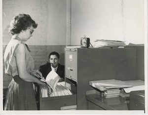 Woman filing folders