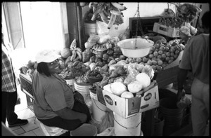 Woman selling produce in the new marketplace, Belize City