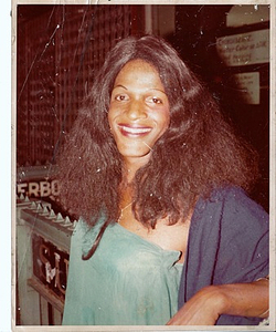 A Photograph of Marsha P. Johnson Wearing a Teal Strapless Top
