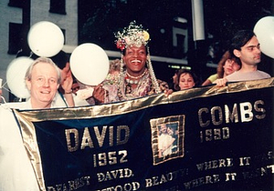 A Photograph of Marsha P. Johnson and Randy Wicker Holding a Quilt for David Combs
