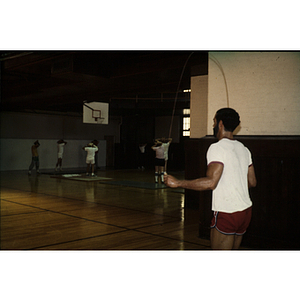 Group of young adults playing basketball