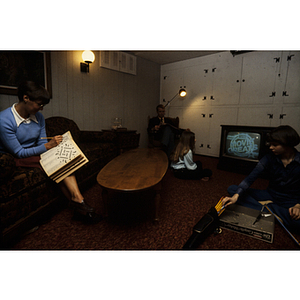 Family doing activities in a recreation room