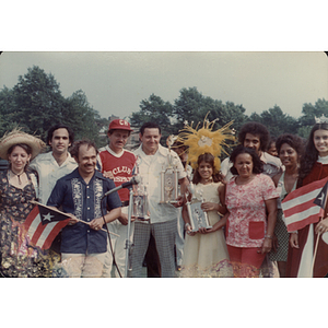 A group of people with trophies at the Festival Puertorriqueño