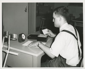 Frank Lettiere using a rolodex