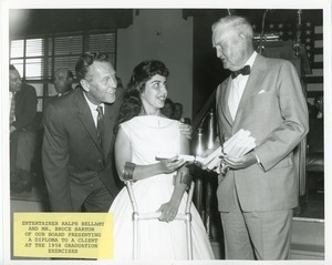 Ralph Bellamy and Bruce Barton presenting a diploma to a client