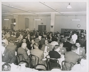 Group of people eating at long tables