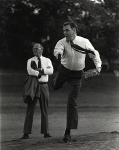 Mayor Raymond L. Flynn playing baseball with Parks and Recreation Commissioner Pat Harrington looking on